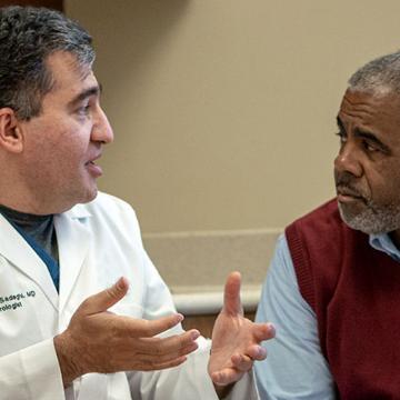 image of a doctor conferring with a patient