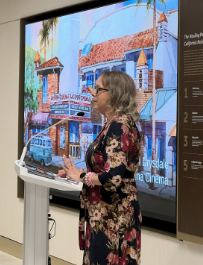 A lady explaining an art piece for Hope is On Display in a presentation