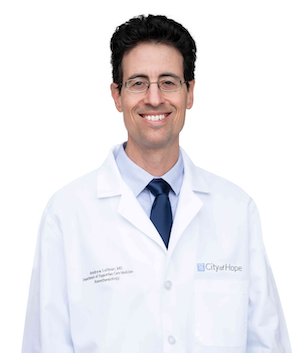 Dr. Leitner in white lab coat
