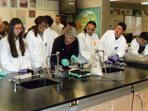 Researcher teaching students