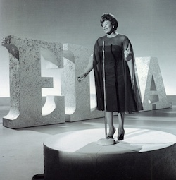 Ella Fitzgerald singing on stage