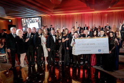 Let's Be Frank committee presenting large check donation