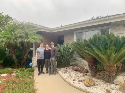 Sharla Moore with her sons, Nathan and Jackson, outside of her home before the Eton fire