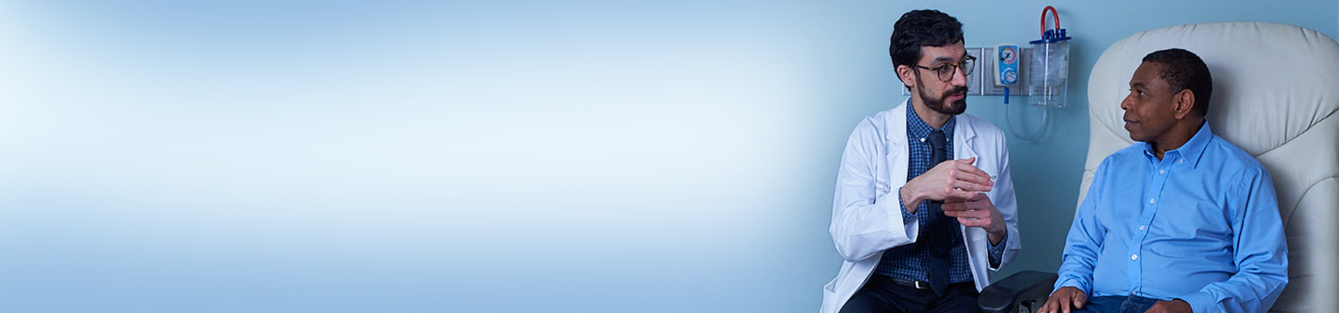 Physician talks to patient