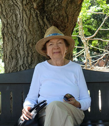 Ines sitting in garden