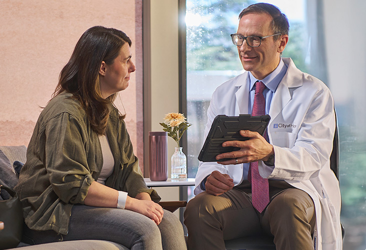 Physician talks to patient
