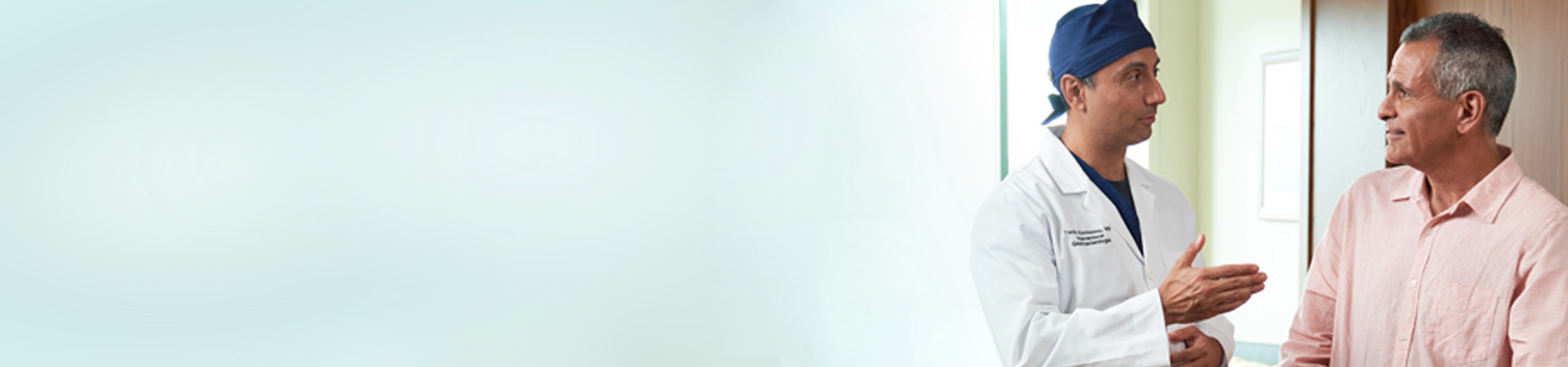 Physician talks to patient