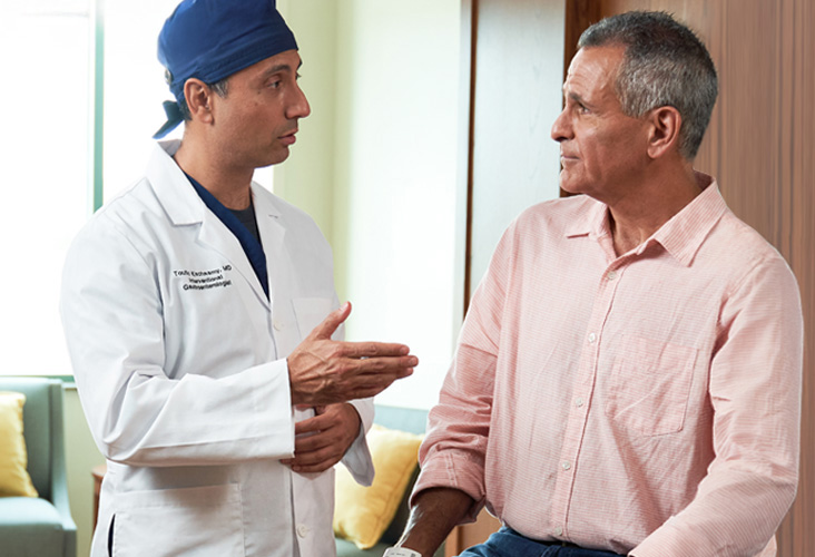 Physician talks to patient