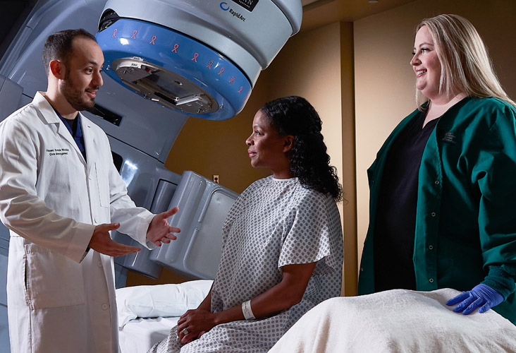 Physician talks to patient