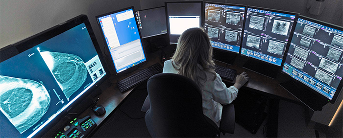 Radiologist looking at breast scans