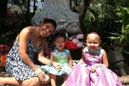 Camila, mom and sister in rose garden