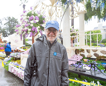 Dr. Stephen Forman in front of the Rose Parade Float