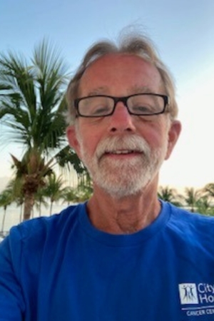 Phil Bosanko wearing a City of Hope shirt on vacation