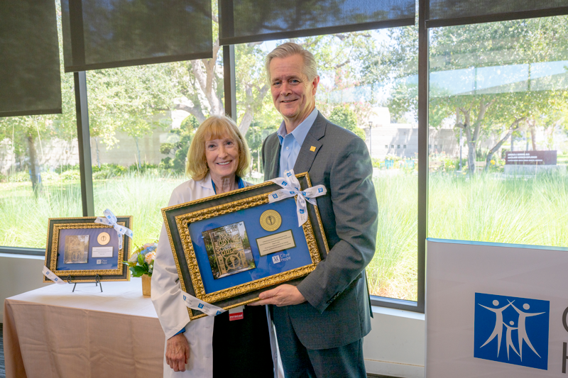 Joanne Mortimer, M.D. with CEO Robert Stone at event to celebrate her endowed professorship gift