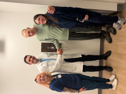 Les Balaszek ringing the bell with the City of Hope team