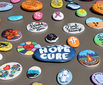 Painted Hope Rocks featuring messages of hope at Celebration Plaza