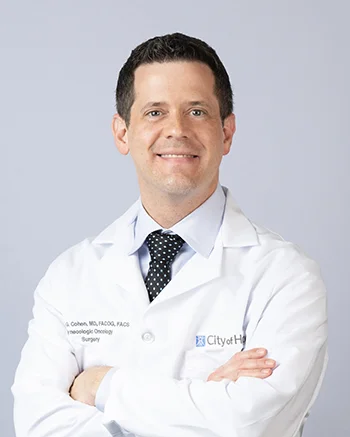 Joshua G. Cohen, M.D., in front of a gray background