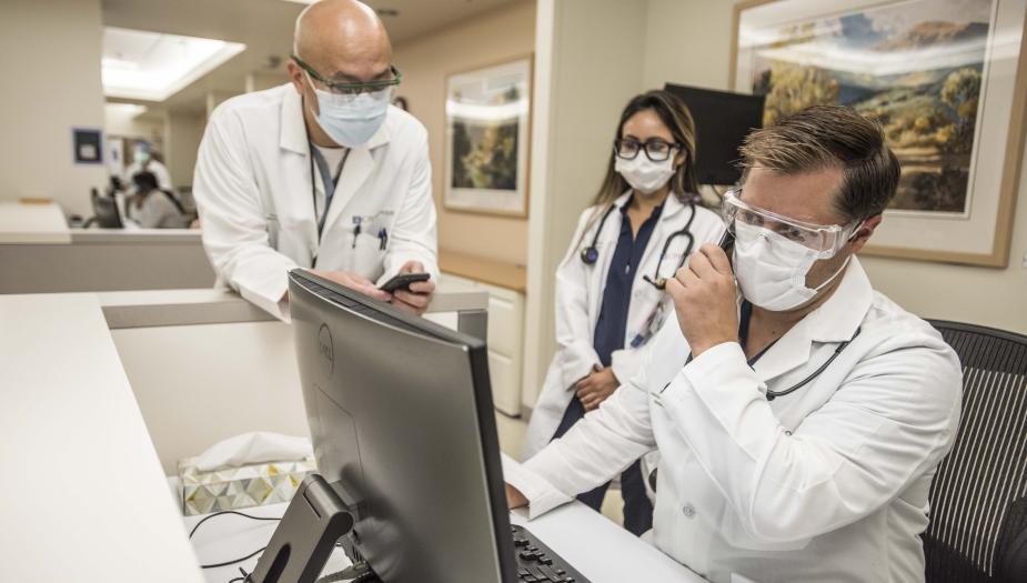 A group of City of Home doctors providing patient care together