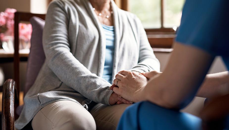 Two people holding hands
