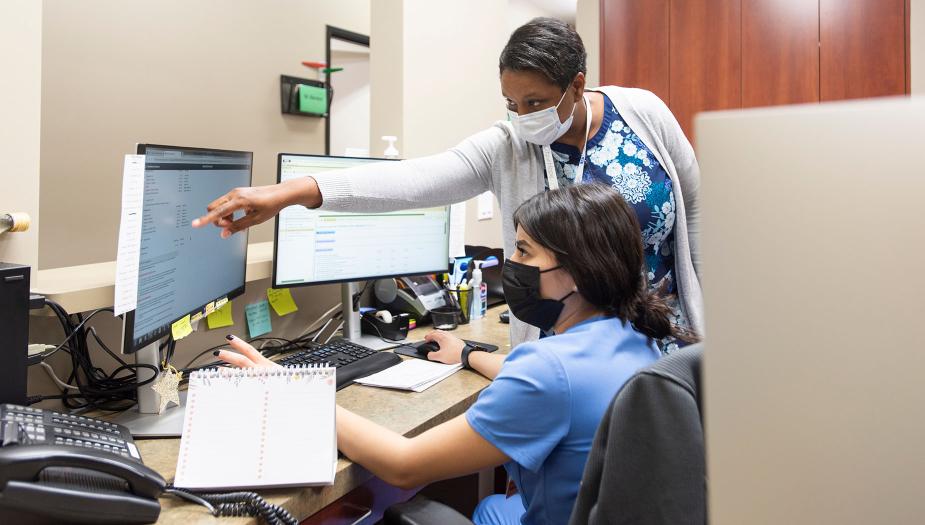 Two employees working on insurance