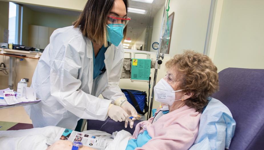 A doctor treating a sitting patient