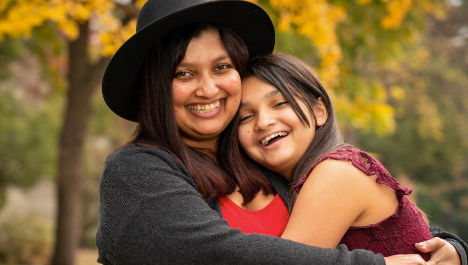 A woman and child hugging