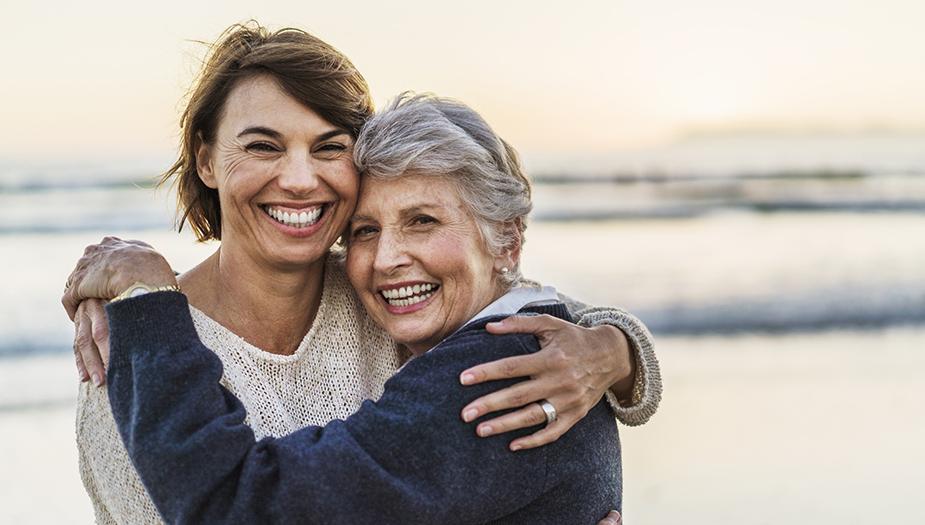 Happy mother and daughter at the beach
