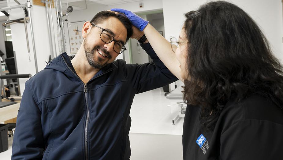A City of Hope patient works with a speech language pathologist
