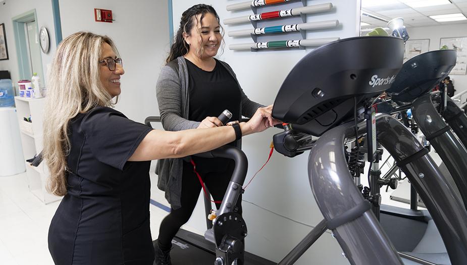 A City of Hope patient works with a physical therapist