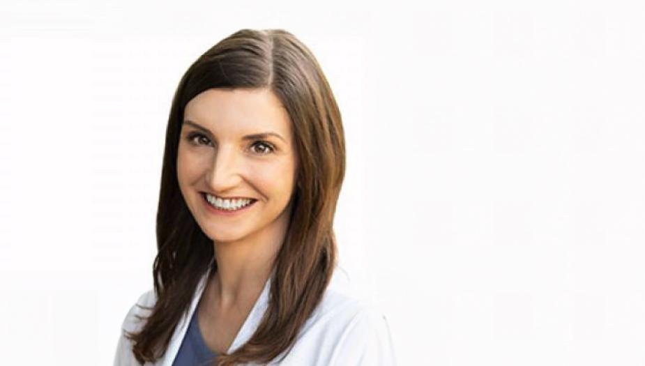 Heather McGee in in white lab coat