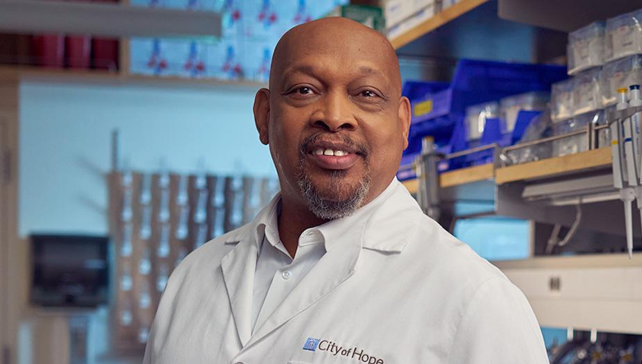 Portrait of John Carpten, Ph.D., in his research laboratory.