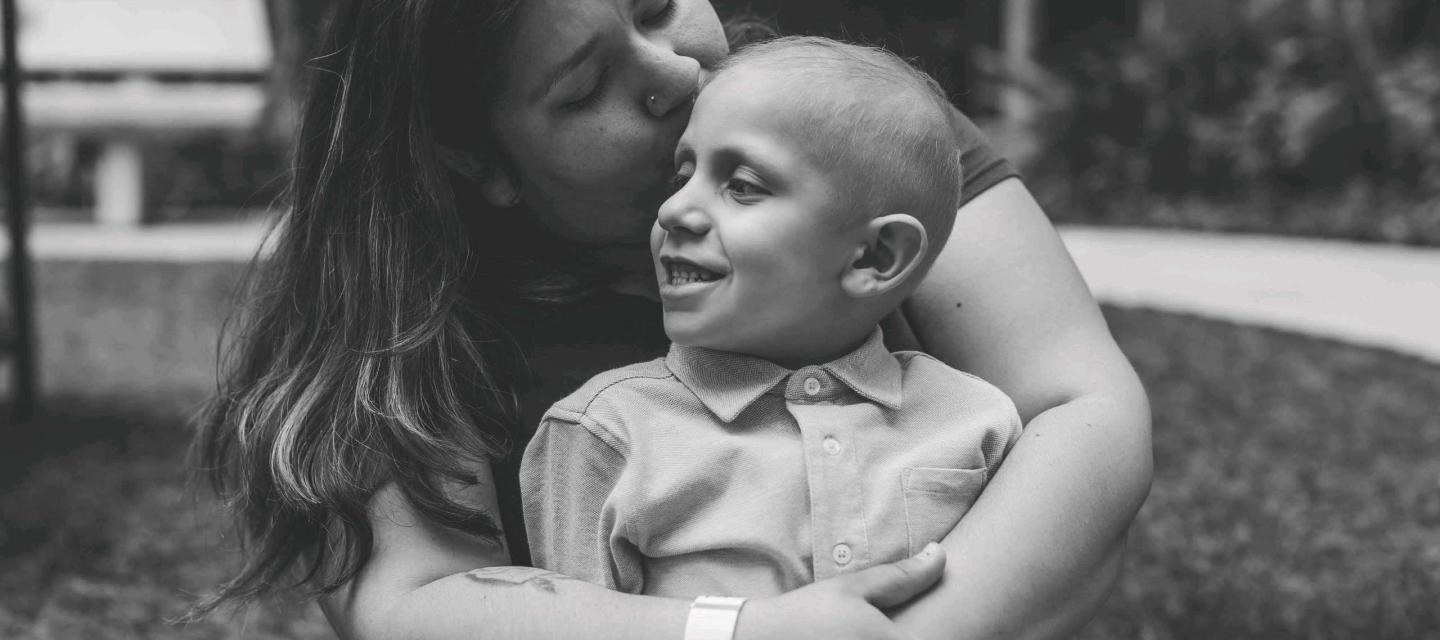 Pediatric Joseph, tenderly embraced by his mother.