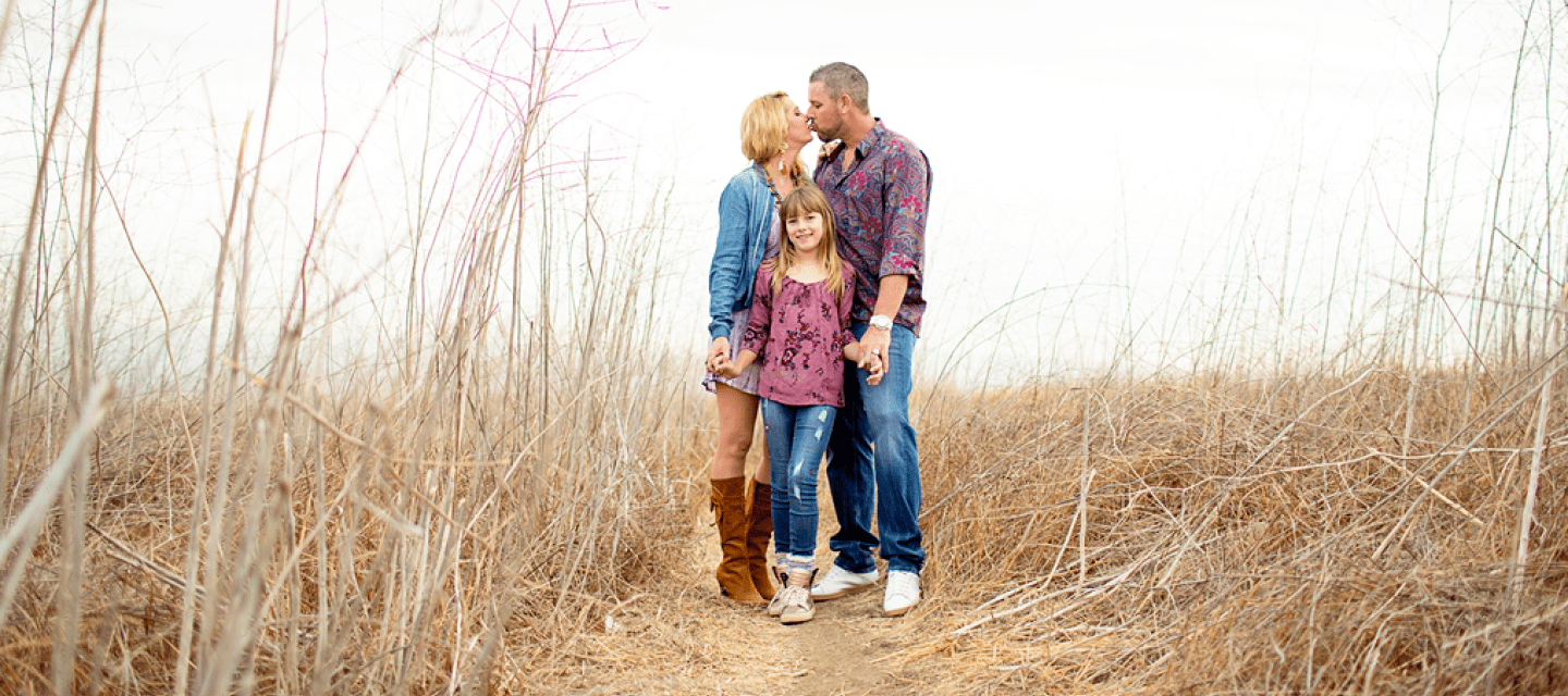 Cancer survivor Gary Heyer, his wife, and daughter celebrate love and life in a vibrant tapestry of wildflowers