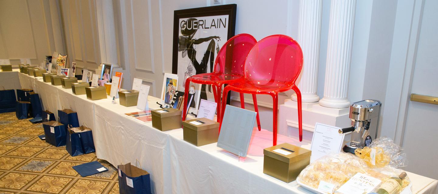 Auction table espresso machine and red acrylic chairs