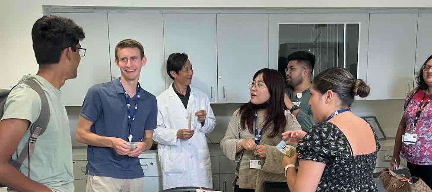 A lab meeting at the Yun Rose Li lab