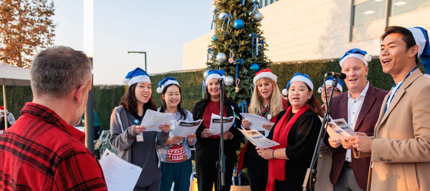 Orange County Team Christmas Caroling at Menorah and Tree Lighting Ceremony