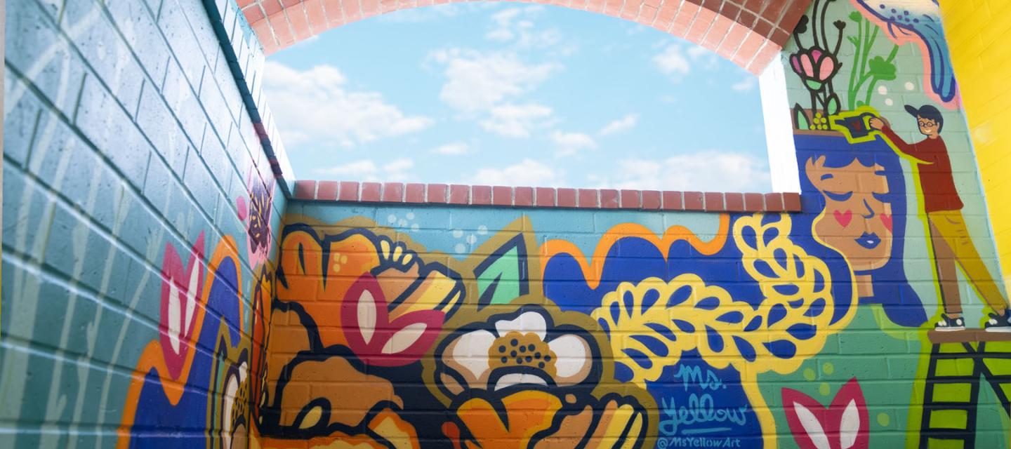 Artist Ms. Yellow's mural at Newport Beach Lido