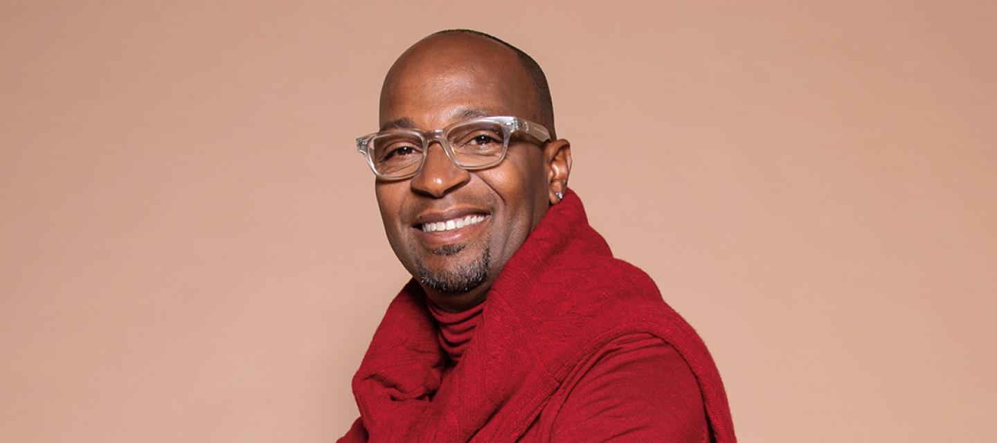 songwriter and vocal producer Kuk Harrell smiling joyfully