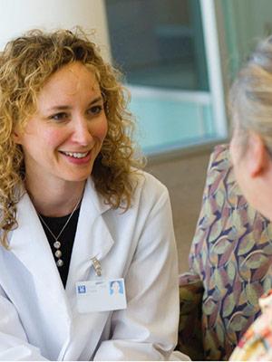 A doctor talking with patients