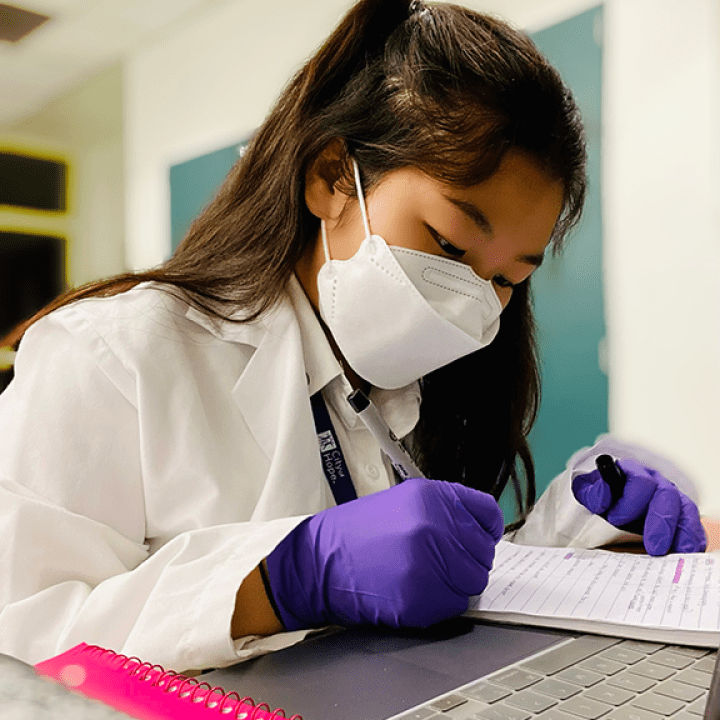Student documenting scientific process