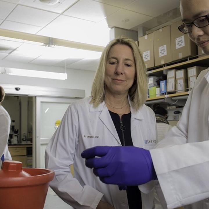 Christine Brown Lab White Coat Pipette