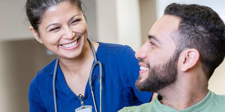 Nurse and patient smilling Getty Images