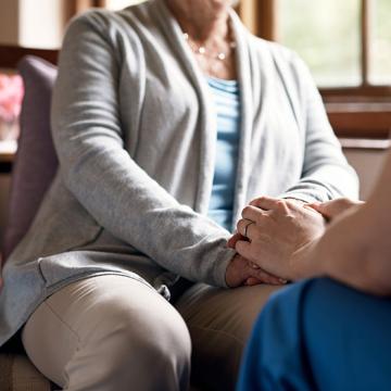 Two people holding hands