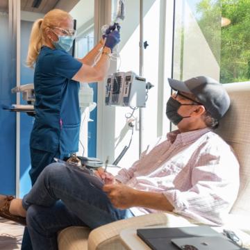 A nurse attending to a patient during treatment
