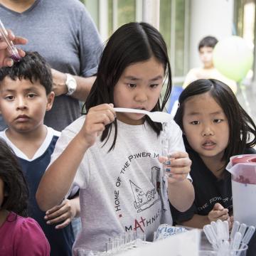 young girl in a science fair