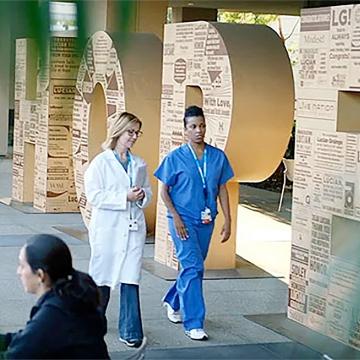 Two healthcare providers walking
