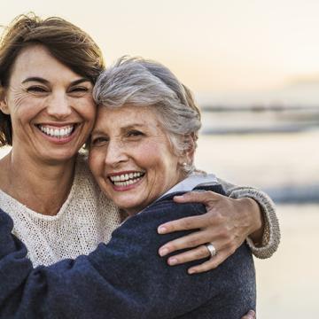 Happy mother and daughter at the beach