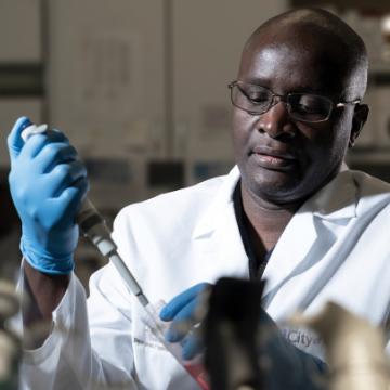Doctor Ogembo working in lab