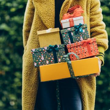 Woman holding holiday gifts