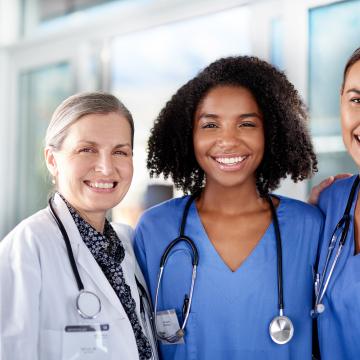 Three women doctors standing together